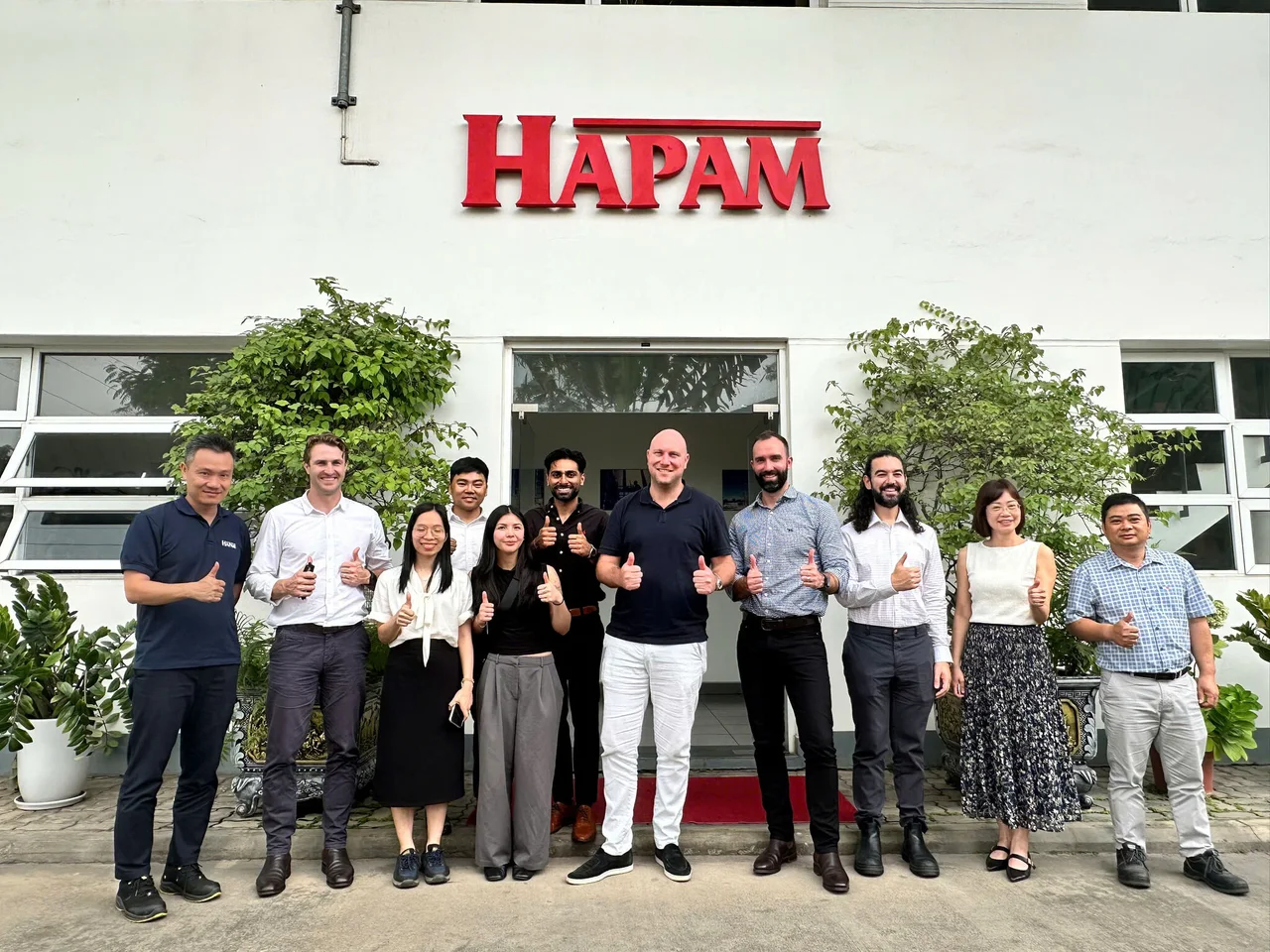 GFF Power and HAPAM team members outside the HAPAM Vietnam facility